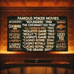 A television screen in a dimly lit room displaying a list of the best poker movies.