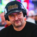 Phil Hellmuth, the legendary poker champion with multiple WSOP bracelets, sitting at a poker table with a focused expression, preparing to make a move