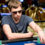 Poker champion Gleb Tremzin smiling after victory.