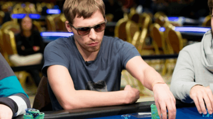 Poker champion Gleb Tremzin smiling after victory.