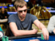 Poker champion Gleb Tremzin smiling after victory.