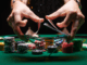 Aggressive poker strategy illustration showing player making bold bets at the table