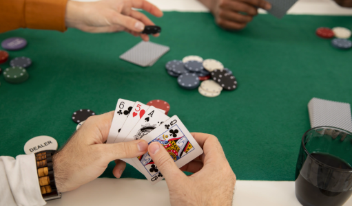 Знімок екрана 2025-10-25 134238 "People playing poker at a table, focusing on cards and chips"